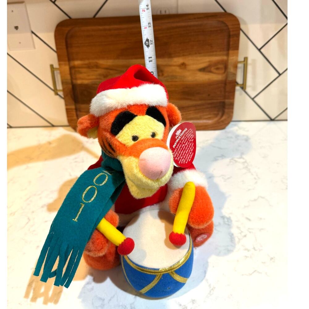 Disney Store 2001 Christmas Tigger Plush that sings appears to play the drums